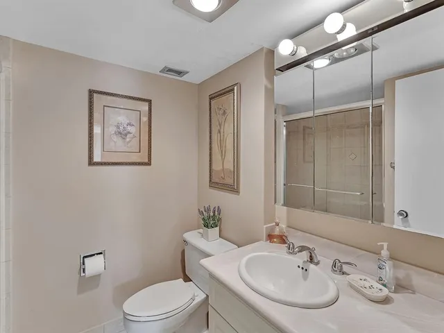 a bathroom with a glass shower door