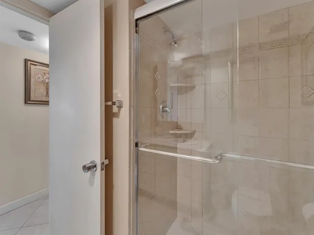 a view of a swimming pool and outdoor seating