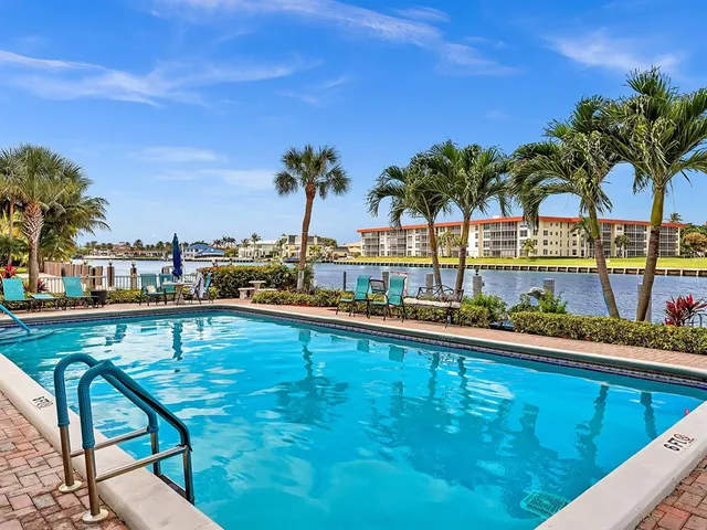 a view of a lake with couches and city view