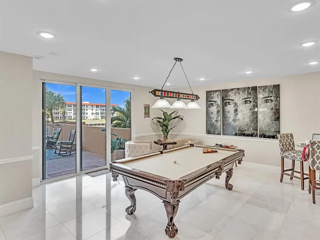 a lobby with furniture and a floor to ceiling window