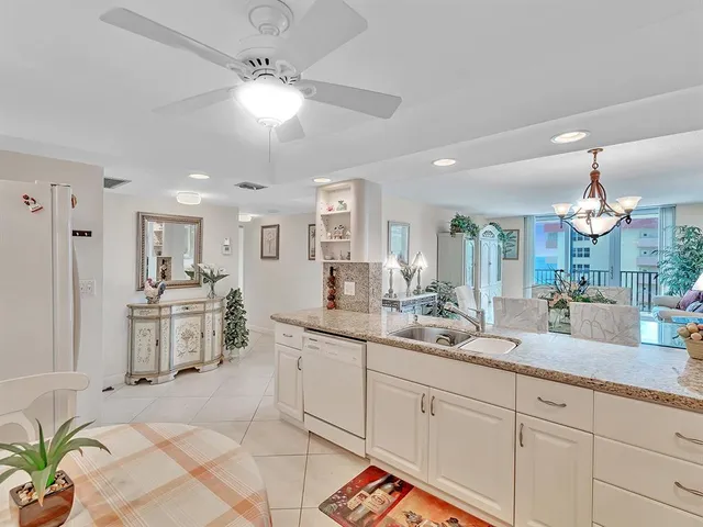 a spacious en suite bathroom with double vanity and a mirror