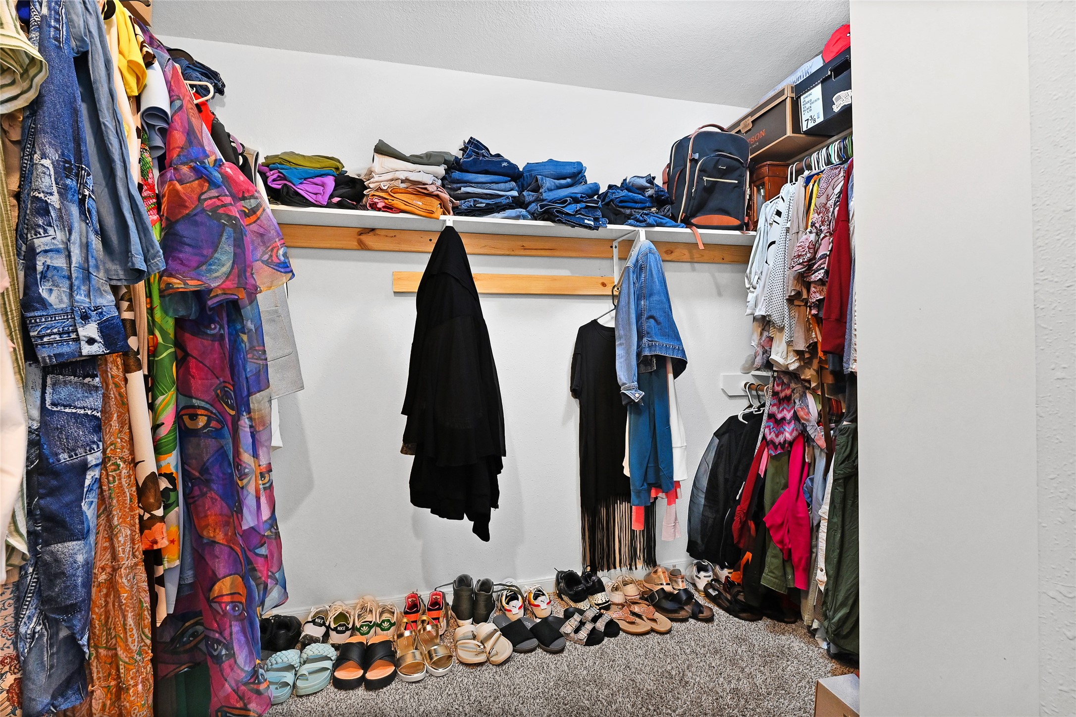 10100 Spring Pl Drive Houston, TX 77070 - Photo 20 of 24 Spacious walk-in closet offering ample storage and organization space.