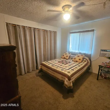 a bed sitting in a room next to a window