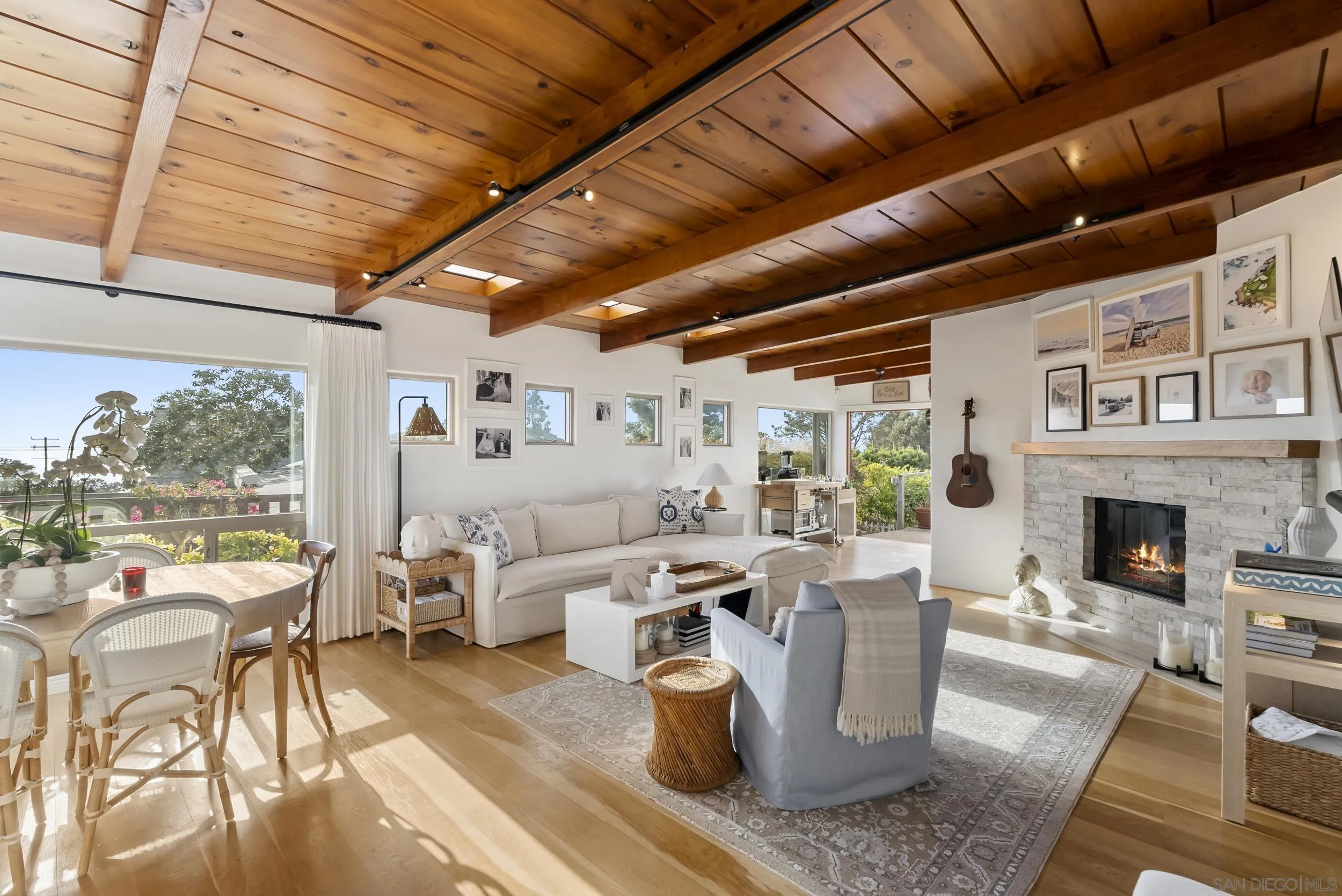 520 10th Street Del Mar, CA 92014 - Photo 3 of 9 a living room with fireplace furniture and a large window