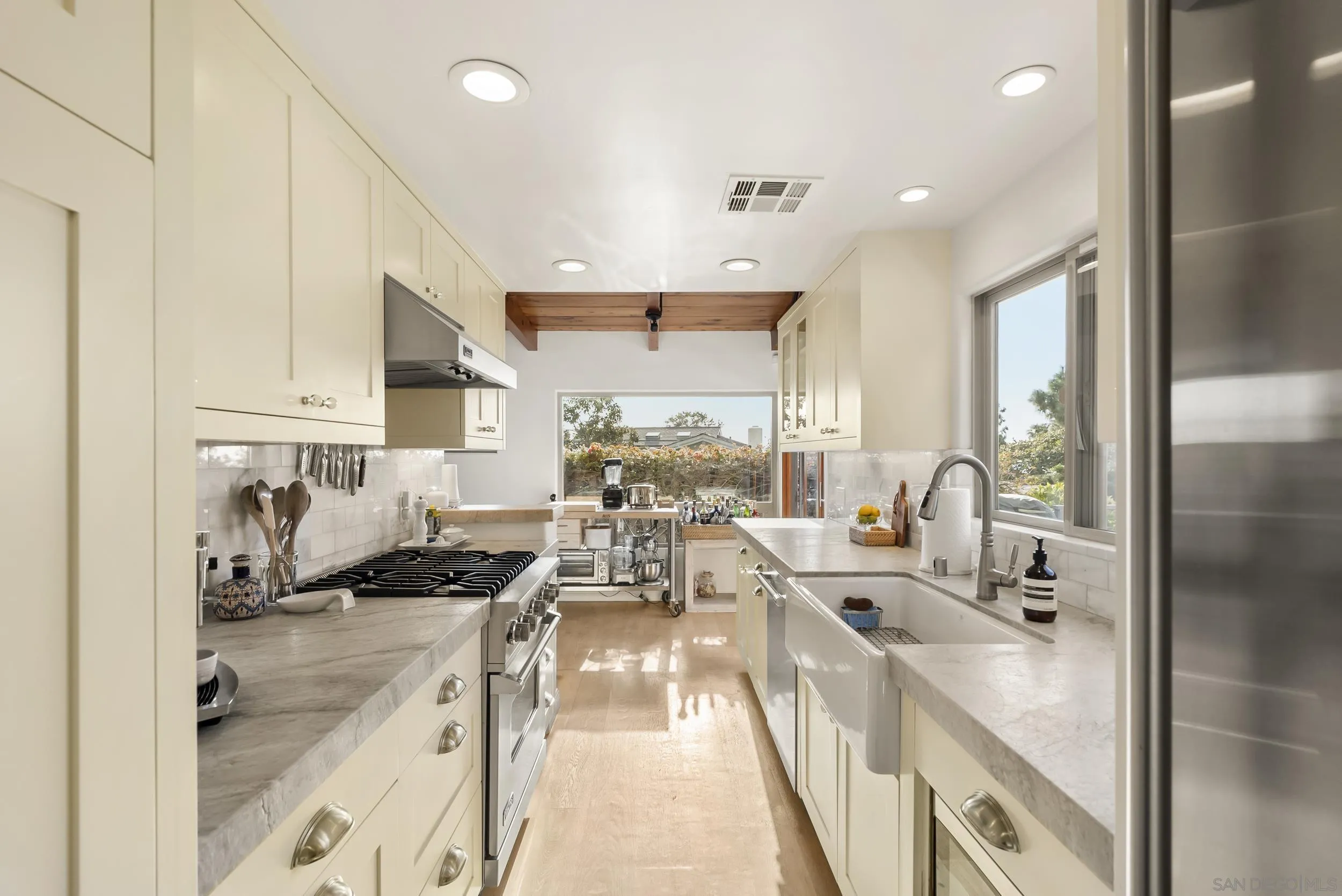 520 10th Street Del Mar, CA 92014 - Photo 4 of 9 a kitchen with sink refrigerator and window