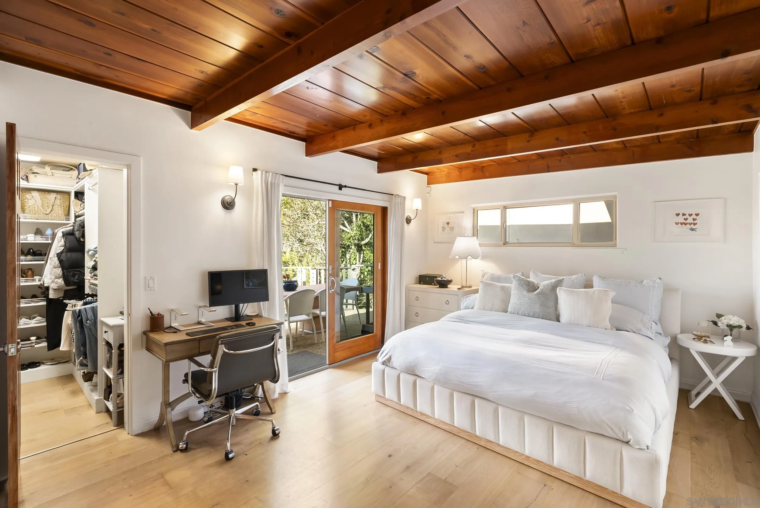 520 10th Street Del Mar, CA 92014 - Photo 6 of 9 a bedroom with a bed a desk and chair with window