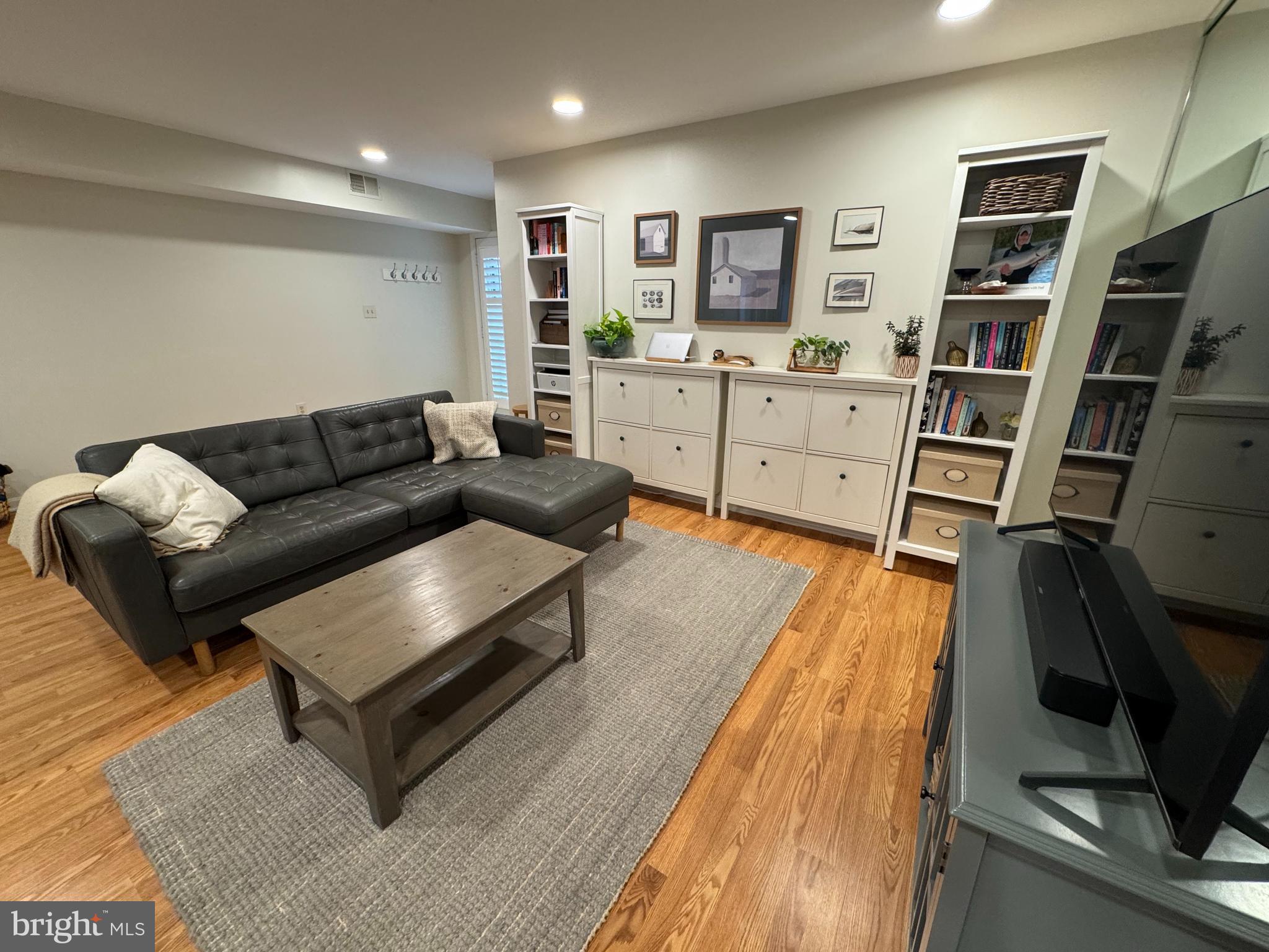 34 Queen Anne Way, Unit F Chester, MD 21619 - Photo 12 of 21 a living room with furniture and a flat screen tv