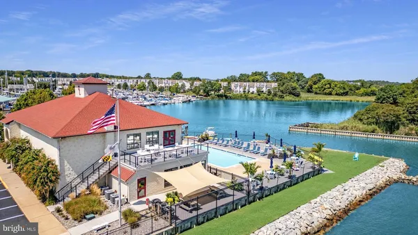 an aerial view of a house with a lake view