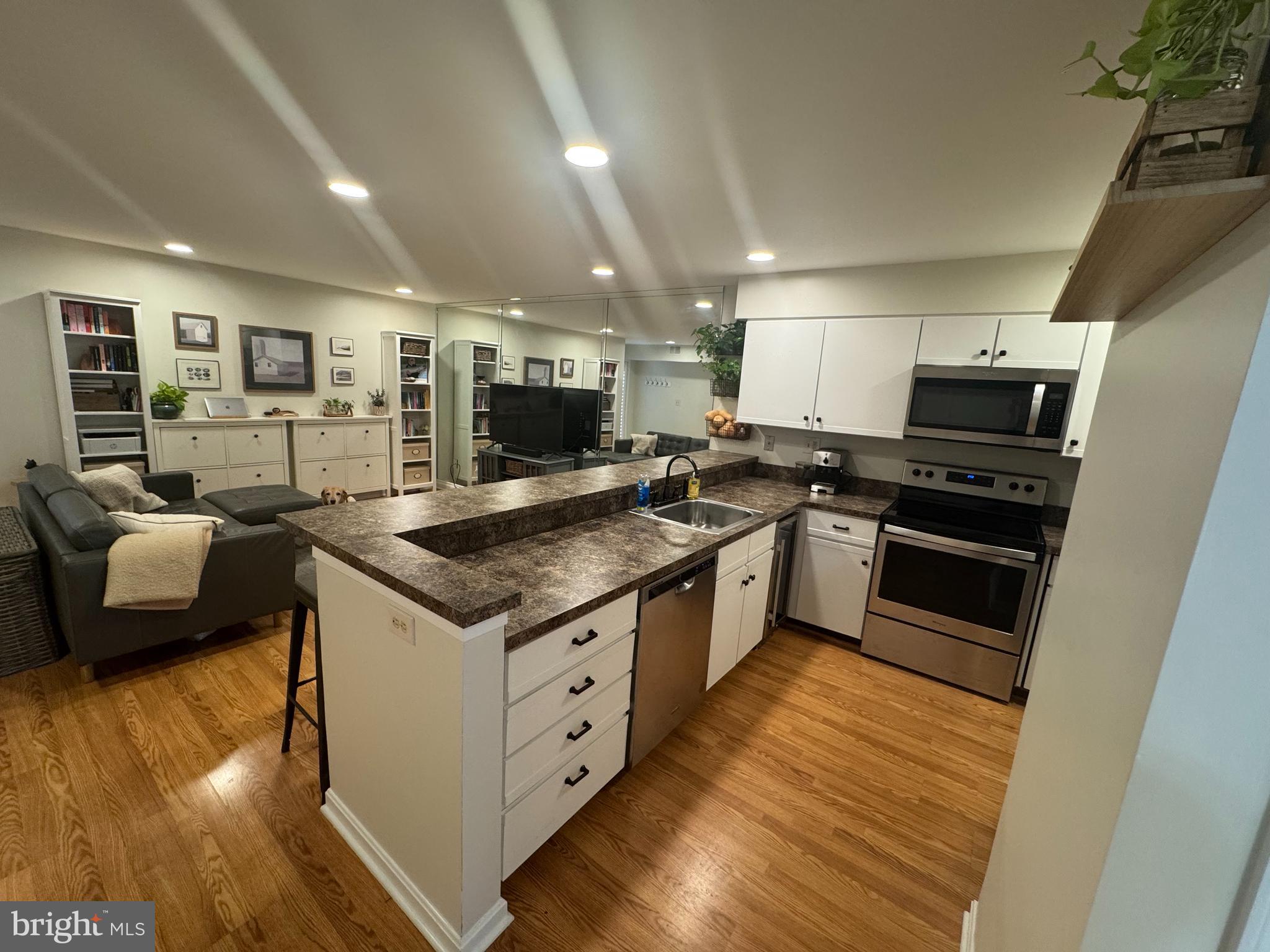 34 Queen Anne Way, Unit F Chester, MD 21619 - Photo 4 of 21 a kitchen with granite countertop a sink and counter top space