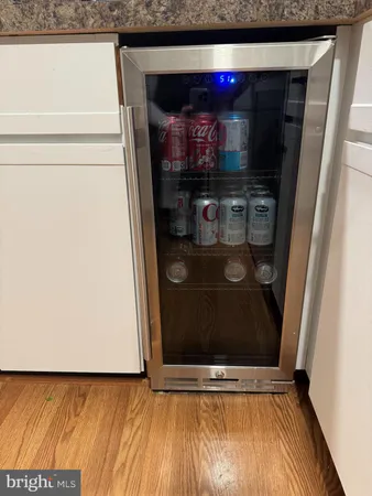 a view of water heater room with wooden floor