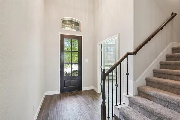 a view of entryway with wooden floor