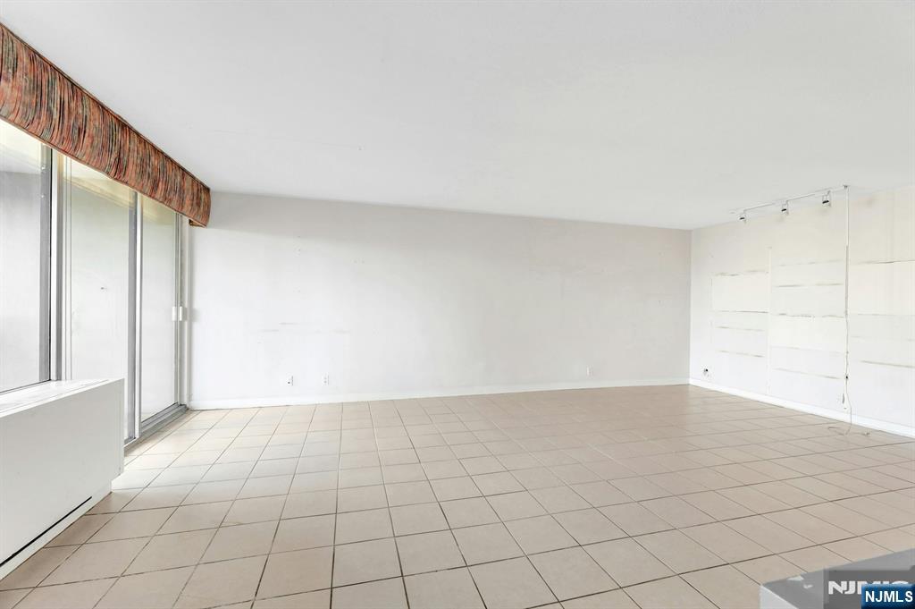 5 Horizon Road, Unit 907 Fort Lee, NJ 07024 - Photo 21 of 48 a view of an empty room and window