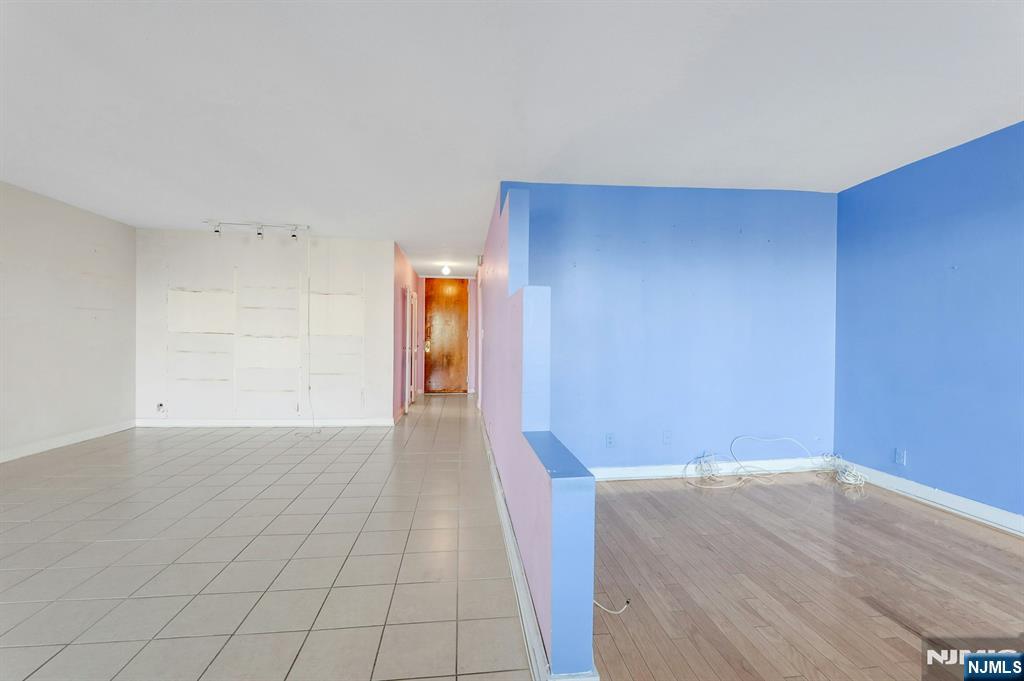 5 Horizon Road, Unit 907 Fort Lee, NJ 07024 - Photo 29 of 48 a view of a room with wooden floor