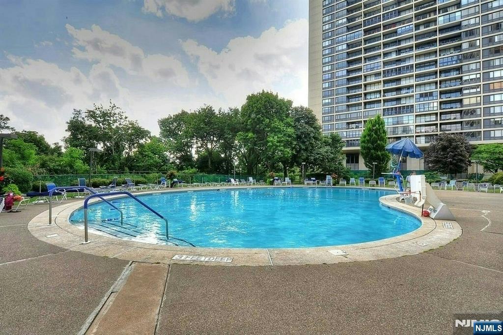 5 Horizon Road, Unit 907 Fort Lee, NJ 07024 - Photo 47 of 48 a view of a swimming pool with a sitting area