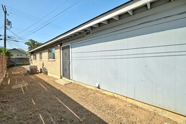 a view of backyard with cabin
