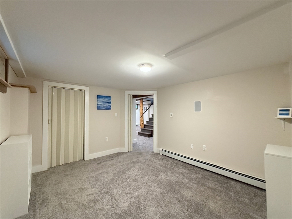 102 Bridge Road Northampton, MA 01062 - Photo 20 of 34 an empty room with closet and windows