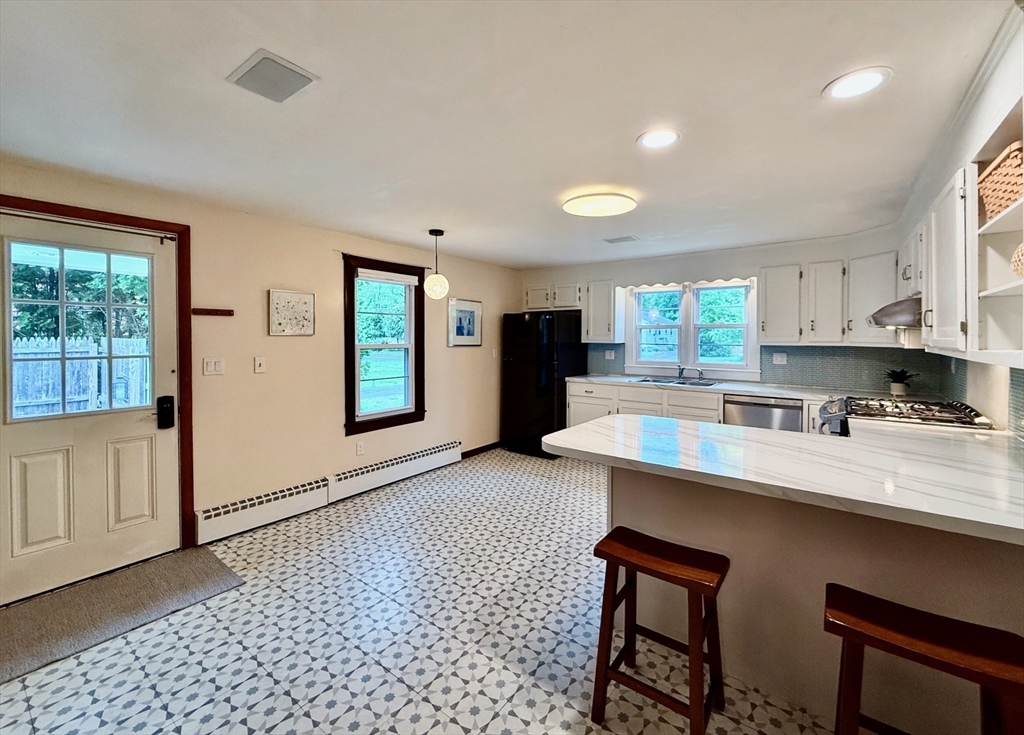 102 Bridge Road Northampton, MA 01062 - Photo 2 of 34 a kitchen with stainless steel appliances granite countertop a sink stove and refrigerator