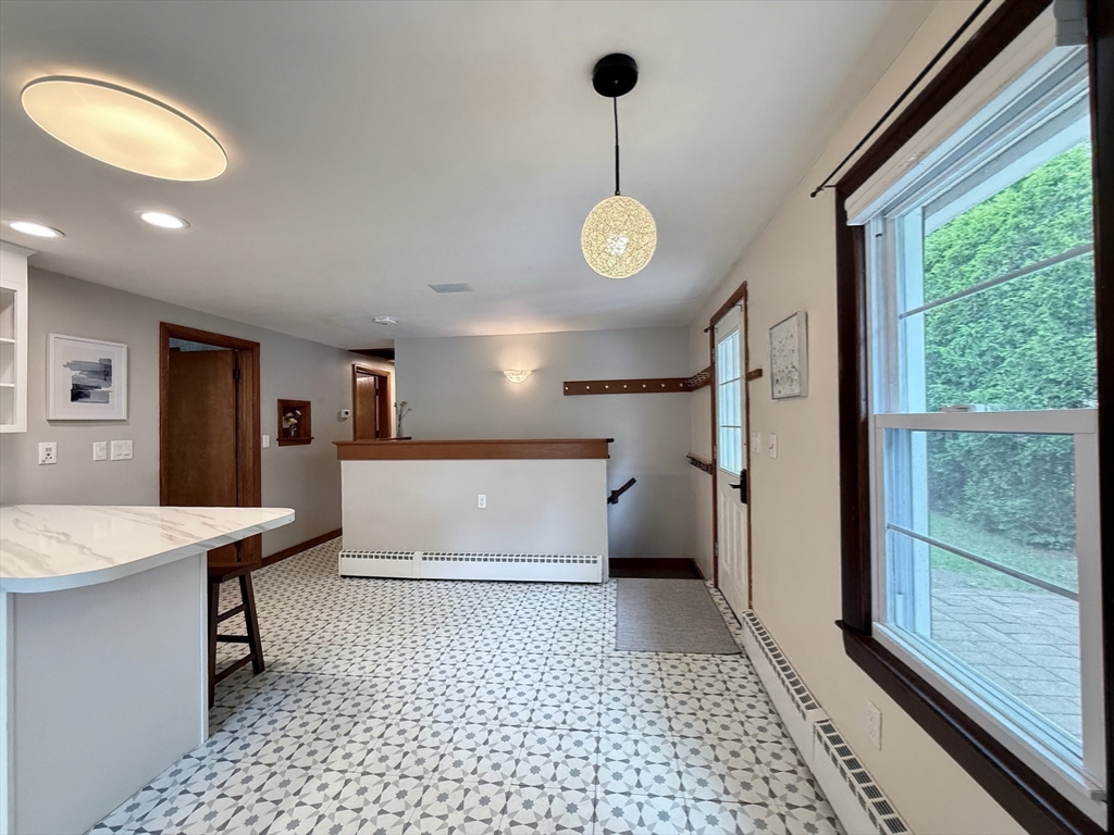 102 Bridge Road Northampton, MA 01062 - Photo 5 of 34 a room with a large window and chandelier