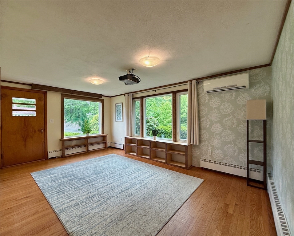 102 Bridge Road Northampton, MA 01062 - Photo 6 of 34 wooden floor in an empty room with a window