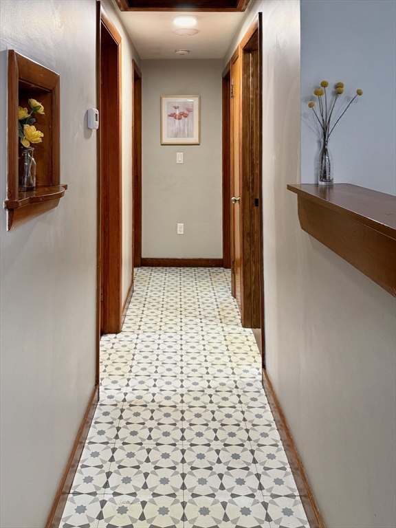 102 Bridge Road Northampton, MA 01062 - Photo 9 of 34 a view of a hallway with wooden floor and a living room