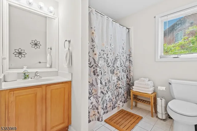 a bathroom with a toilet a sink and a shower