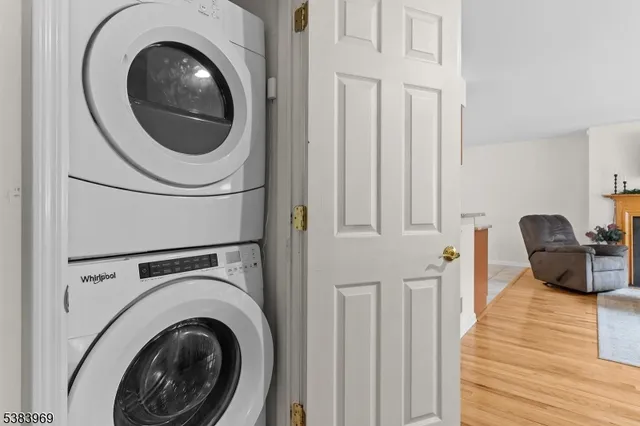 a view of a hallway with washer and dryer