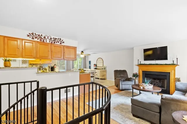 a living room with furniture fireplace and a flat screen tv