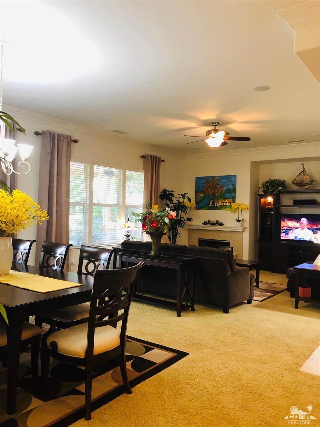 49535 Redford Way Indio, CA 92201 - Photo 12 of 28 a living room with furniture kitchen view and a large window
