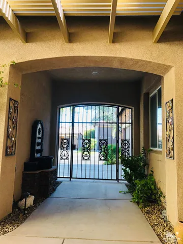 a view of front door and potted plants