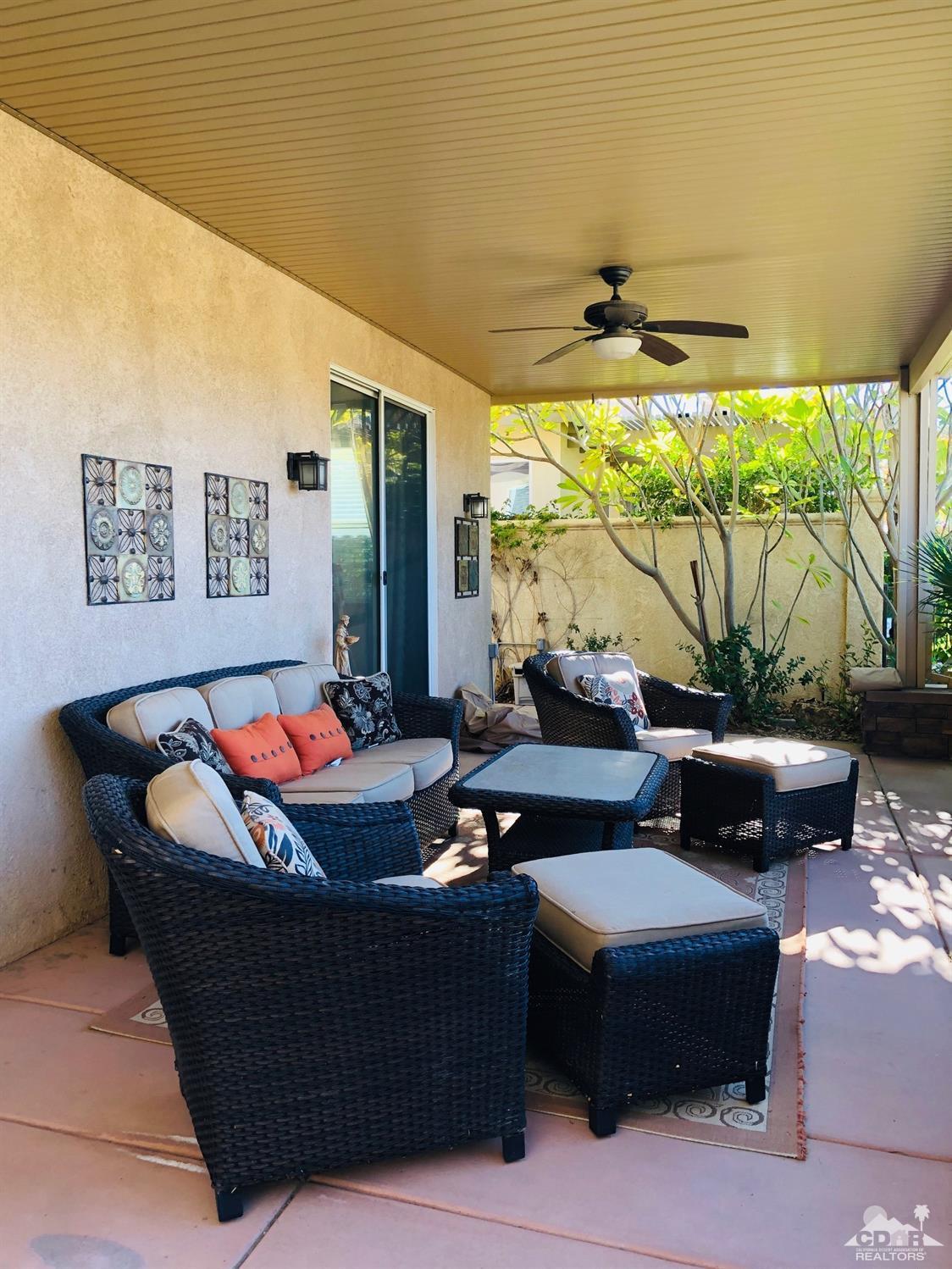 49535 Redford Way Indio, CA 92201 - Photo 16 of 28 a living room with furniture and a large window