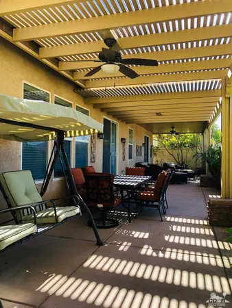a living room with a couch wooden floor and a fireplace