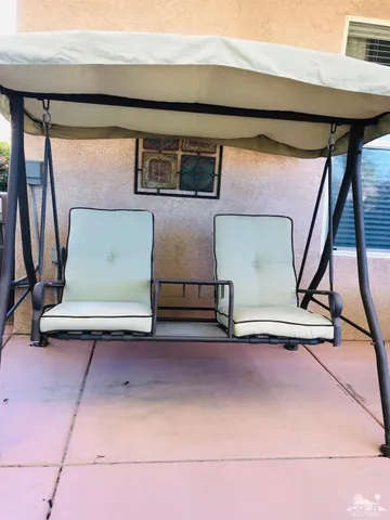 a view of outdoor sitting area with a couch