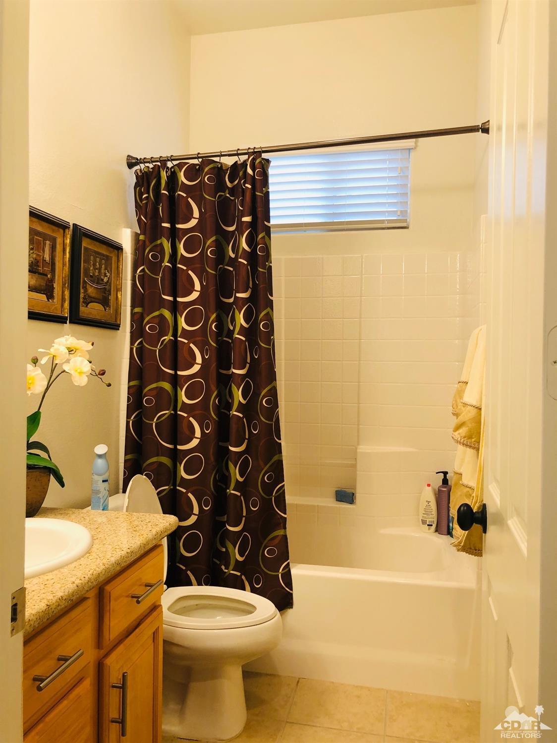 49535 Redford Way Indio, CA 92201 - Photo 21 of 28 a bathroom with a bathtub and shower