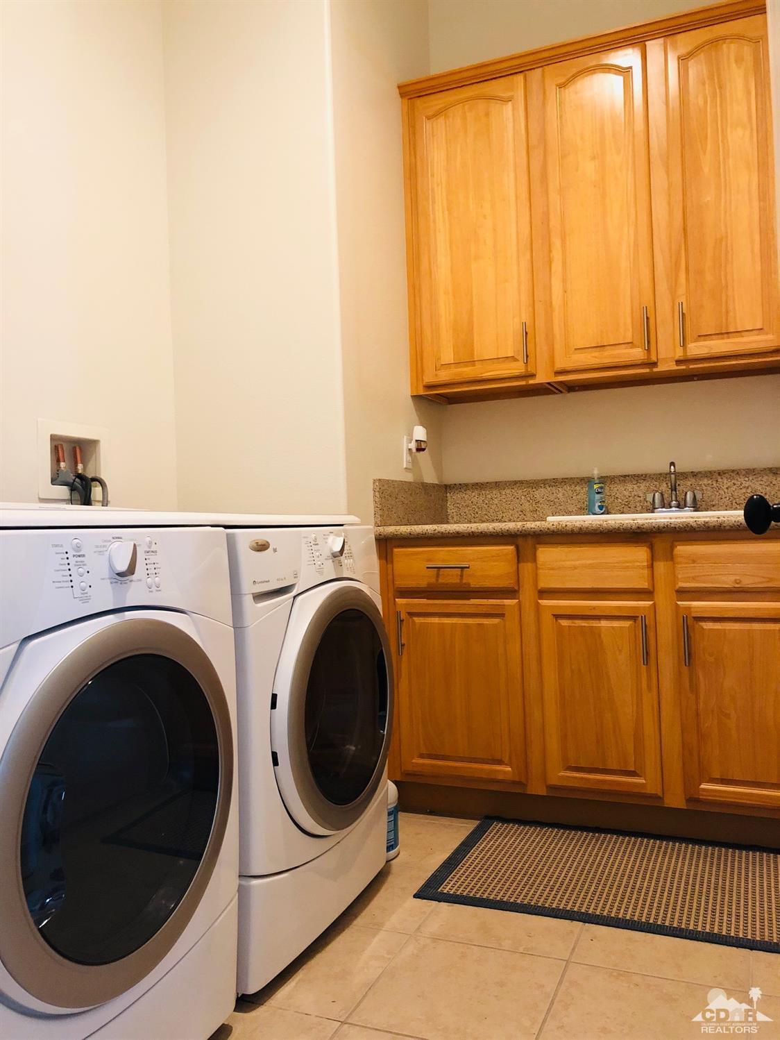 49535 Redford Way Indio, CA 92201 - Photo 25 of 28 a utility room with dryer and washer