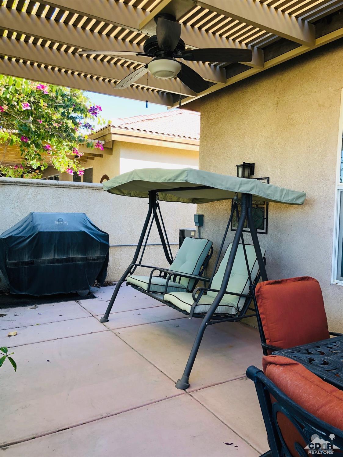 49535 Redford Way Indio, CA 92201 - Photo 26 of 28 a room with table chair and wooden floor