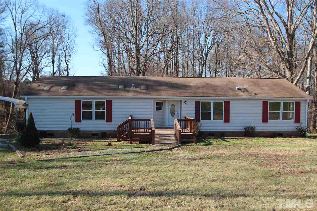 290 Hal Melton Road Roxboro, NC 27574 - Photo 1 of 14 a view of a house with backyard