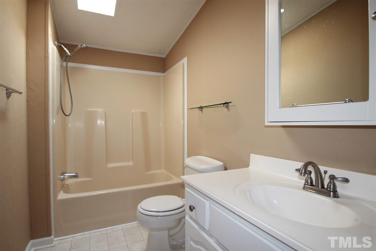 290 Hal Melton Road Roxboro, NC 27574 - Photo 11 of 14 a bathroom with a sink toilet and shower