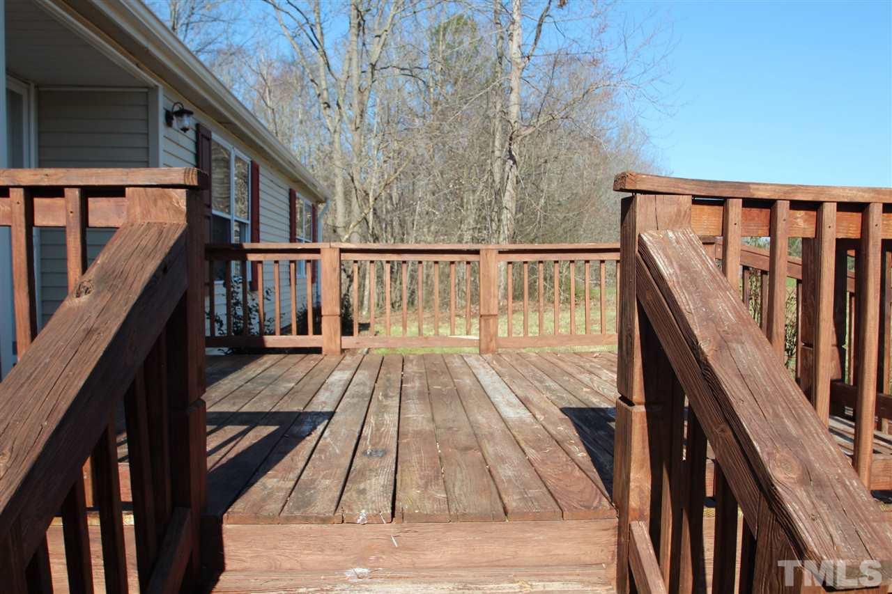 290 Hal Melton Road Roxboro, NC 27574 - Photo 14 of 14 a view of balcony with wooden floor and fence