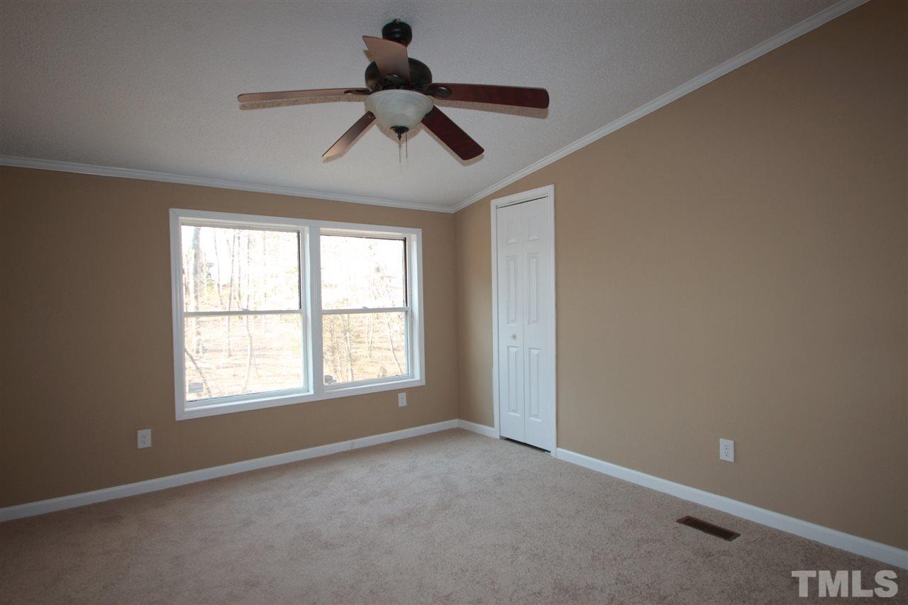 290 Hal Melton Road Roxboro, NC 27574 - Photo 9 of 14 a view of an empty room with a window