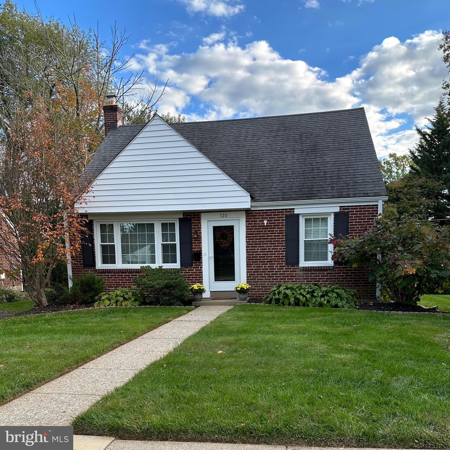 120 Richmond Road Paoli, PA 19301 - Photo 1 of 15 a front view of a house with a garden