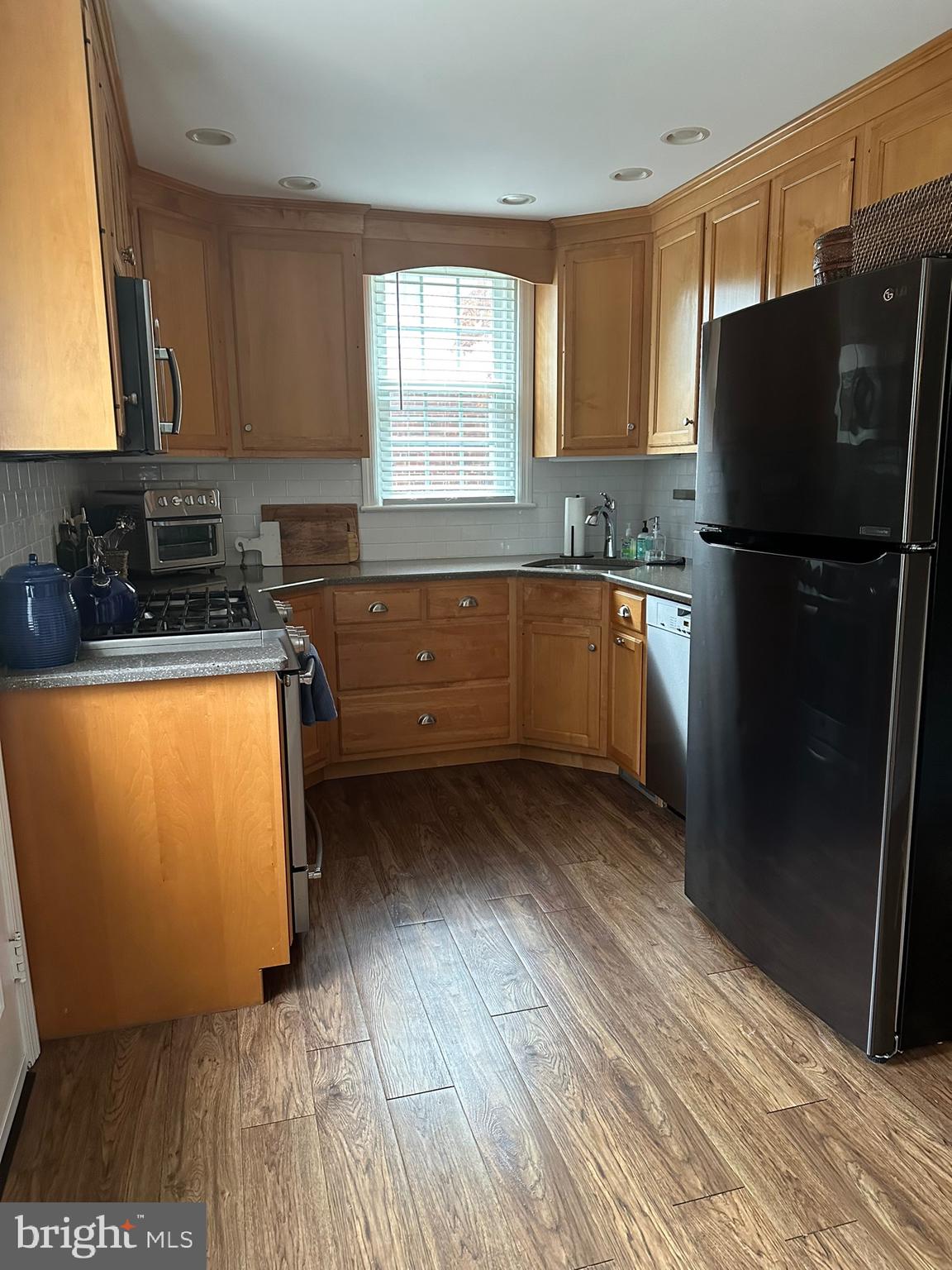 120 Richmond Road Paoli, PA 19301 - Photo 9 of 15 a kitchen with a refrigerator and window