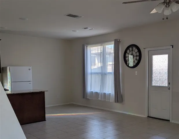 a view of livingroom with furniture and window