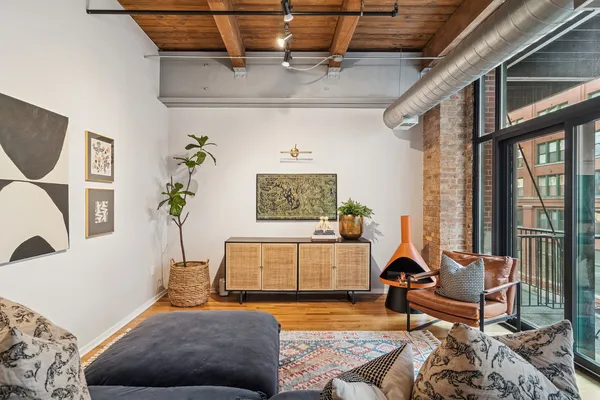 a living room with furniture or couch and a potted plant