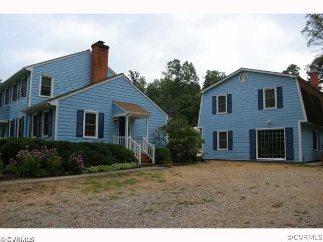 15018 Harrowgate Road Chester, VA 23831 - Photo 2 of 12 a front view of a house with a yard