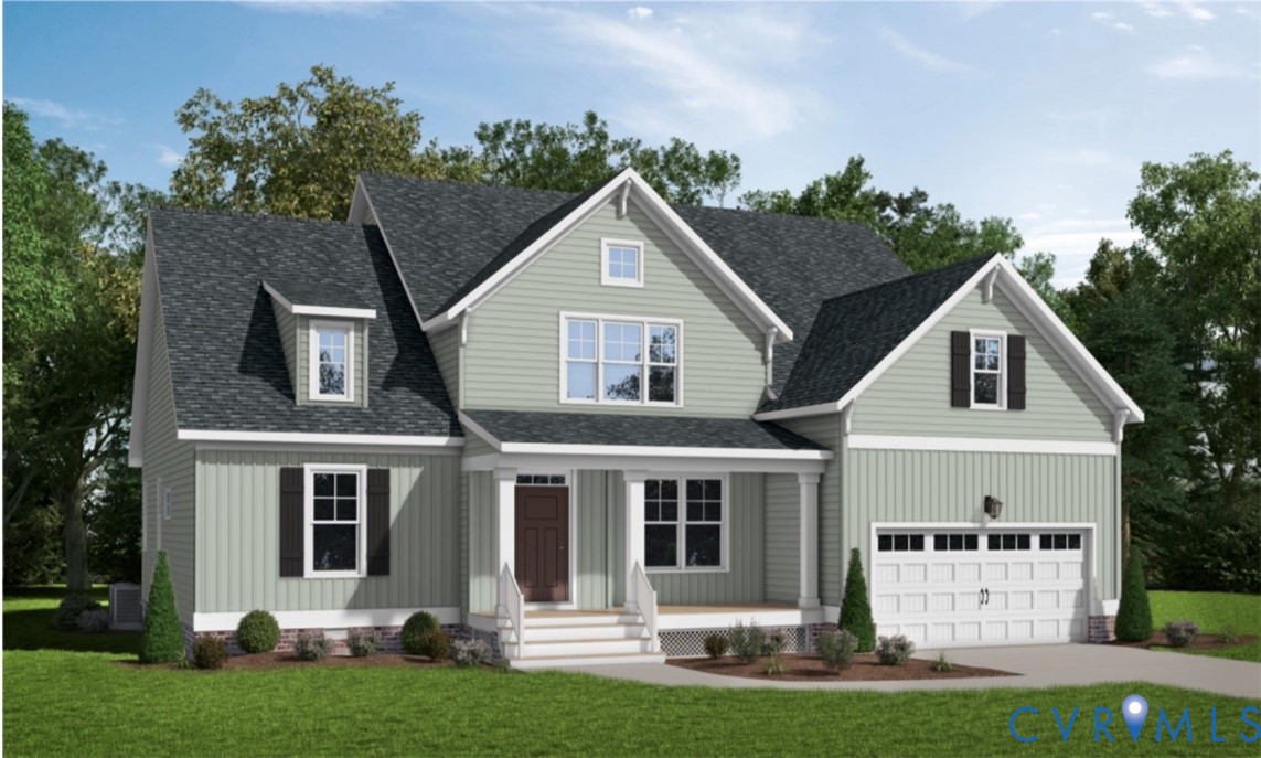 16912 Broadmoor Road Moseley, VA 23120 - Photo 1 of 19 a front view of a house with a yard and garage