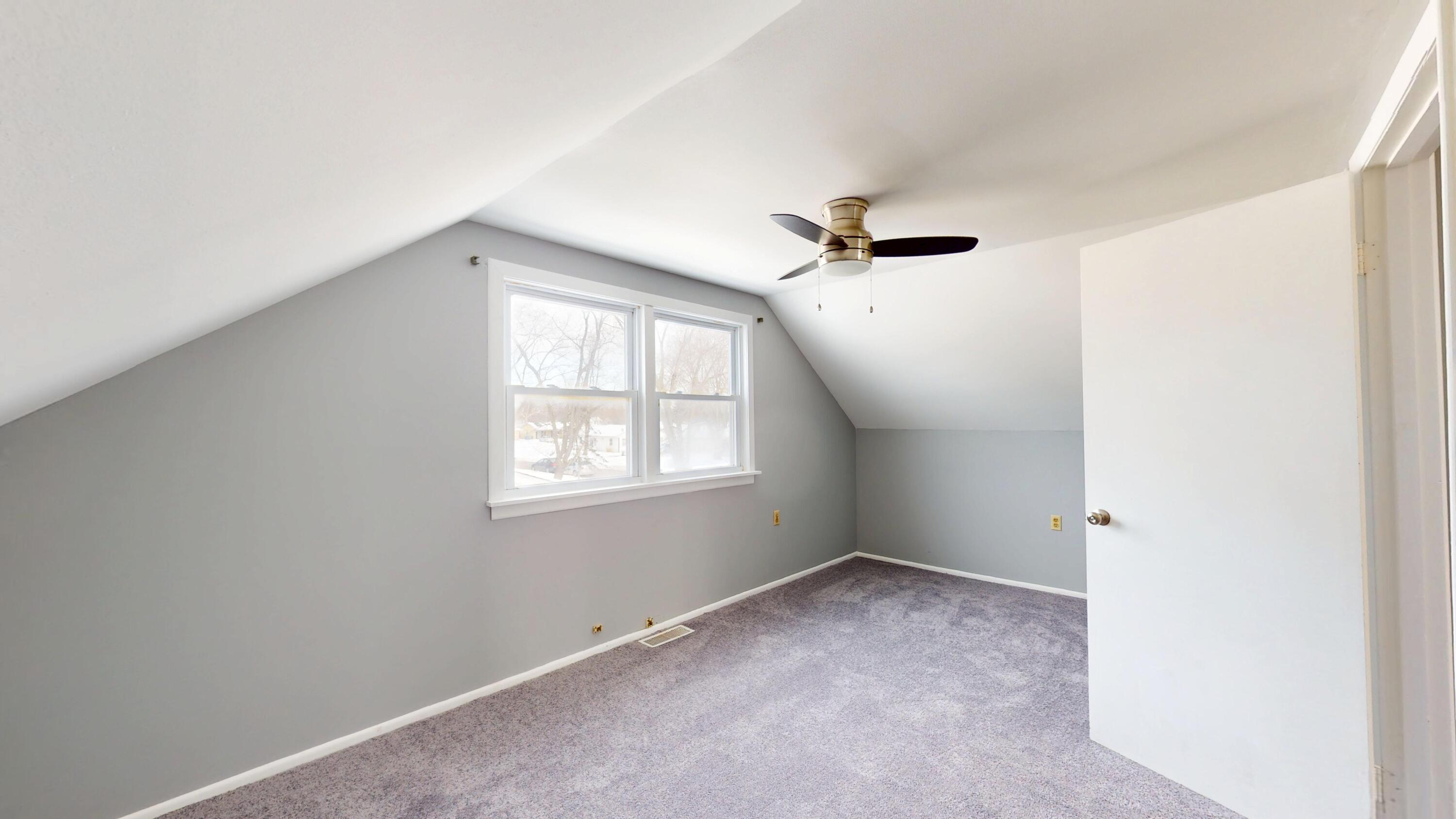 734-1 Juniper Road Valparaiso, IN 46385 - Photo 20 of 34 an empty room with windows and ceiling fan