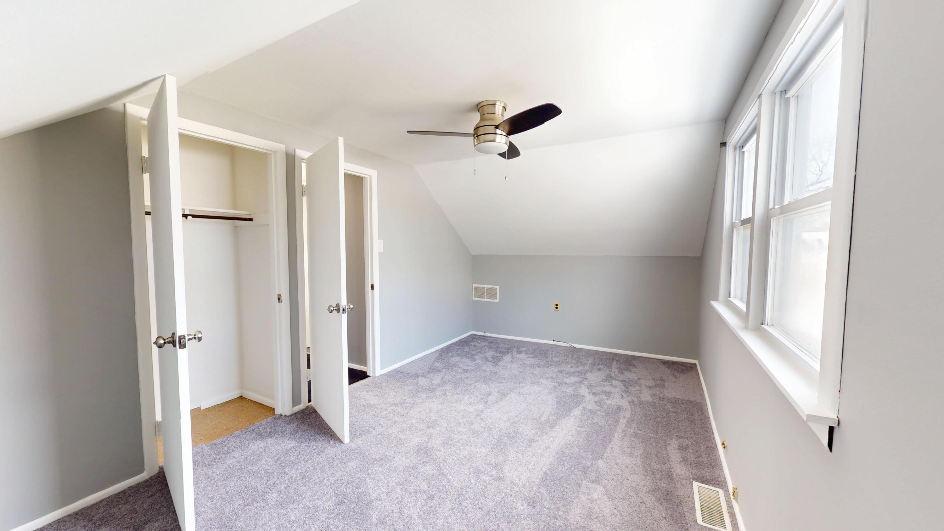 734-1 Juniper Road Valparaiso, IN 46385 - Photo 23 of 34 a view of hallway with a window and a ceiling fan