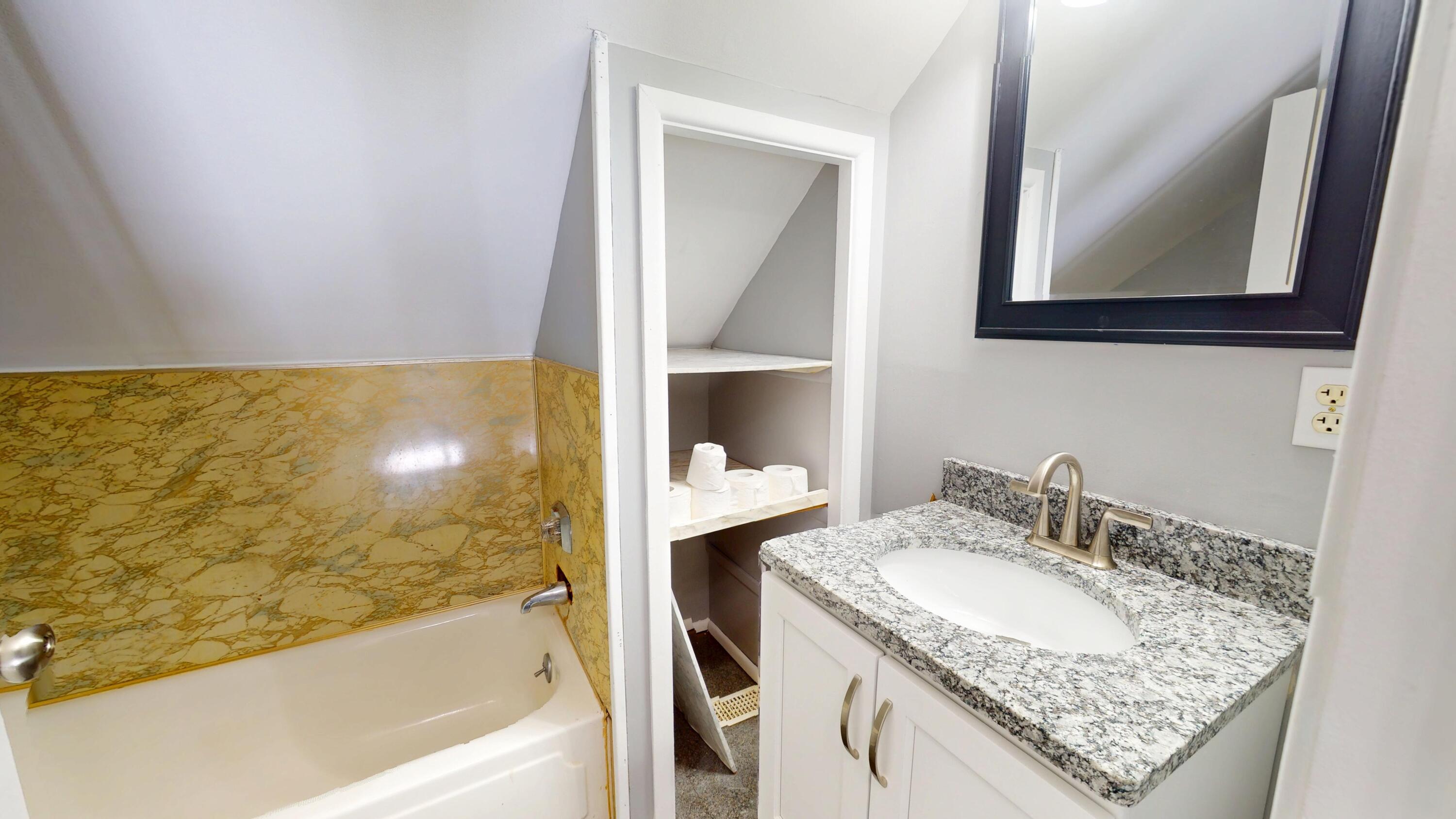 734-1 Juniper Road Valparaiso, IN 46385 - Photo 24 of 34 a bathroom with a granite countertop sink and a mirror