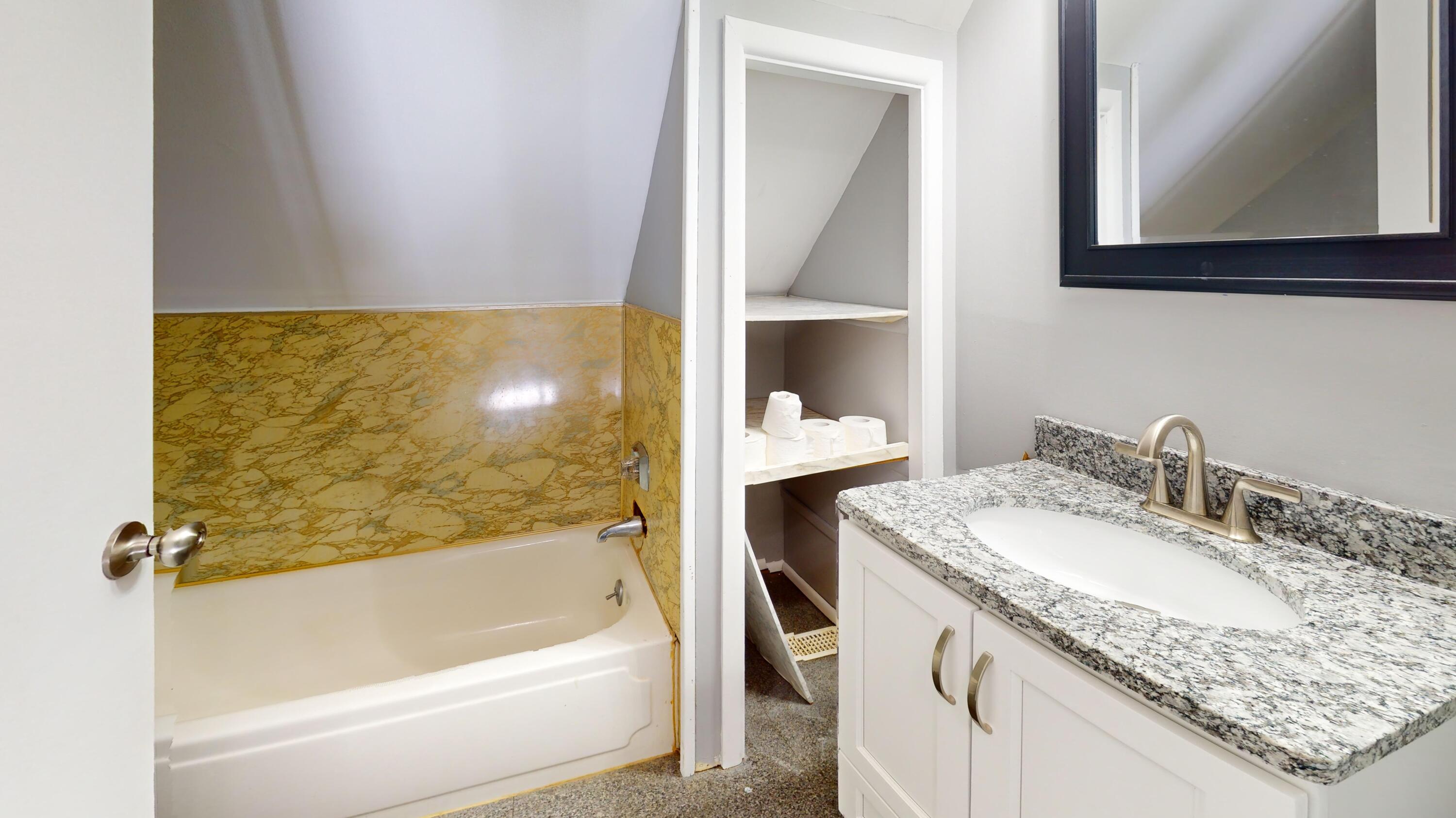 734-1 Juniper Road Valparaiso, IN 46385 - Photo 25 of 34 a bathroom with a granite countertop sink and a mirror