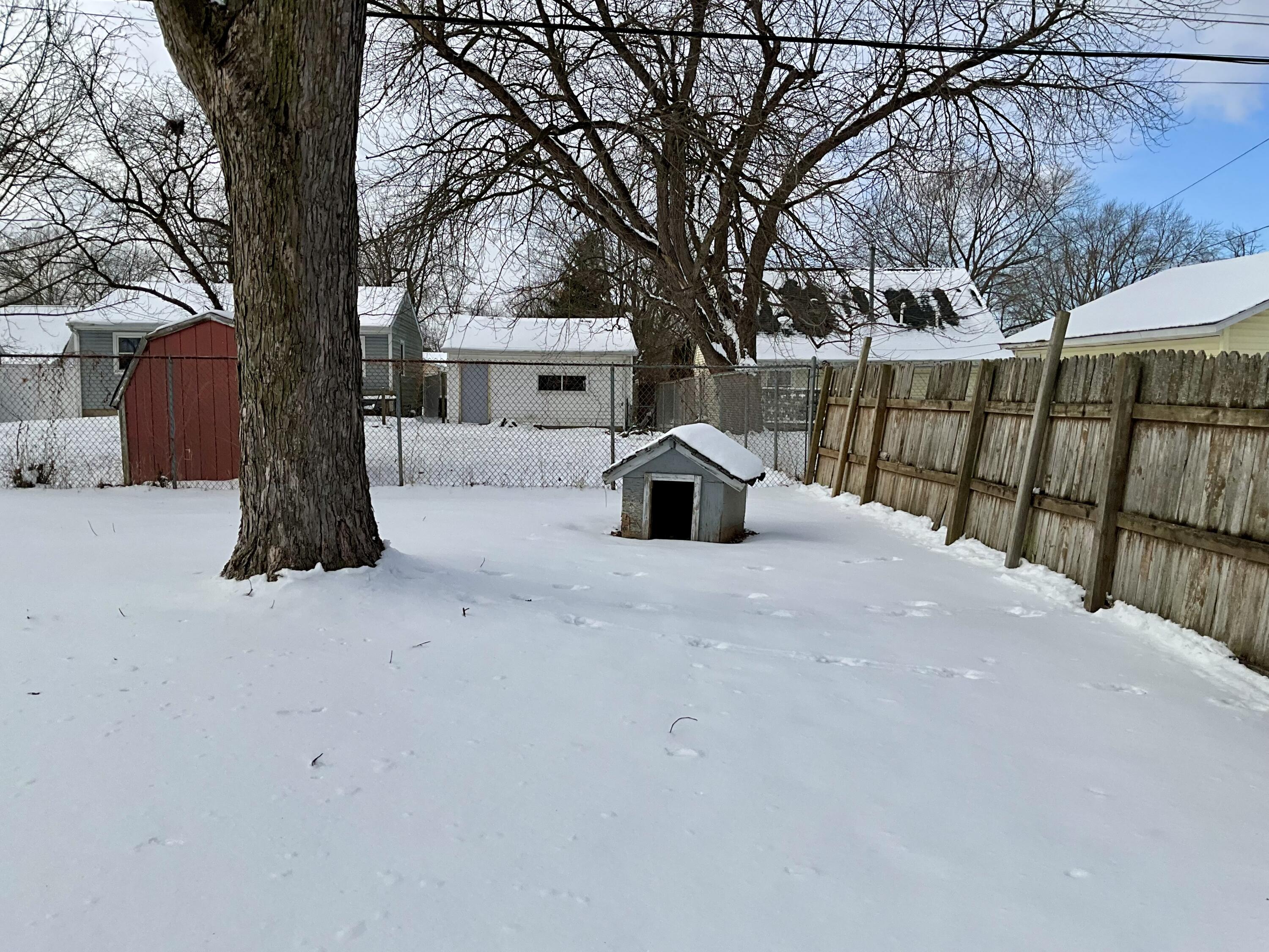 734-1 Juniper Road Valparaiso, IN 46385 - Photo 27 of 34 a palm tree sitting in front of a white house